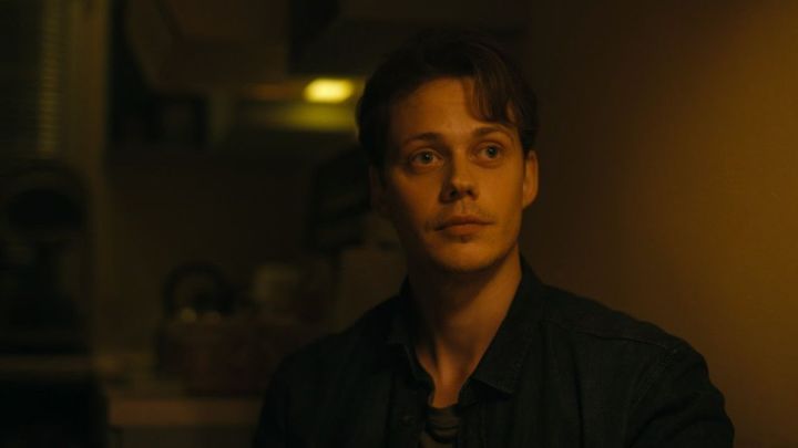 Bill Skarsgård as Keith looking at something off-camera in "Barbarian."