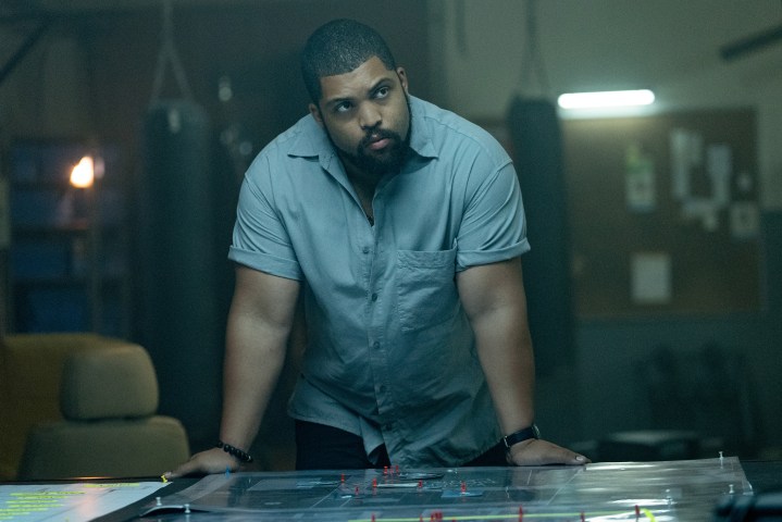 O'Shea Jackson Jr as Donnie Wilson standing above a table in Den of Thieves 2.