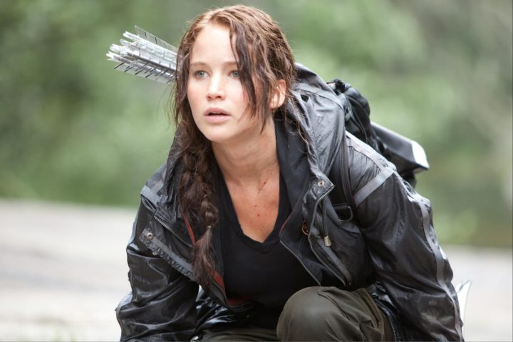 Jennifer Lawrence crouches to the ground in "The Hunger Games."